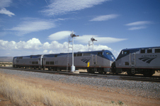 Amtrak train going by semaphores near Chapelle, NM., May 2002.